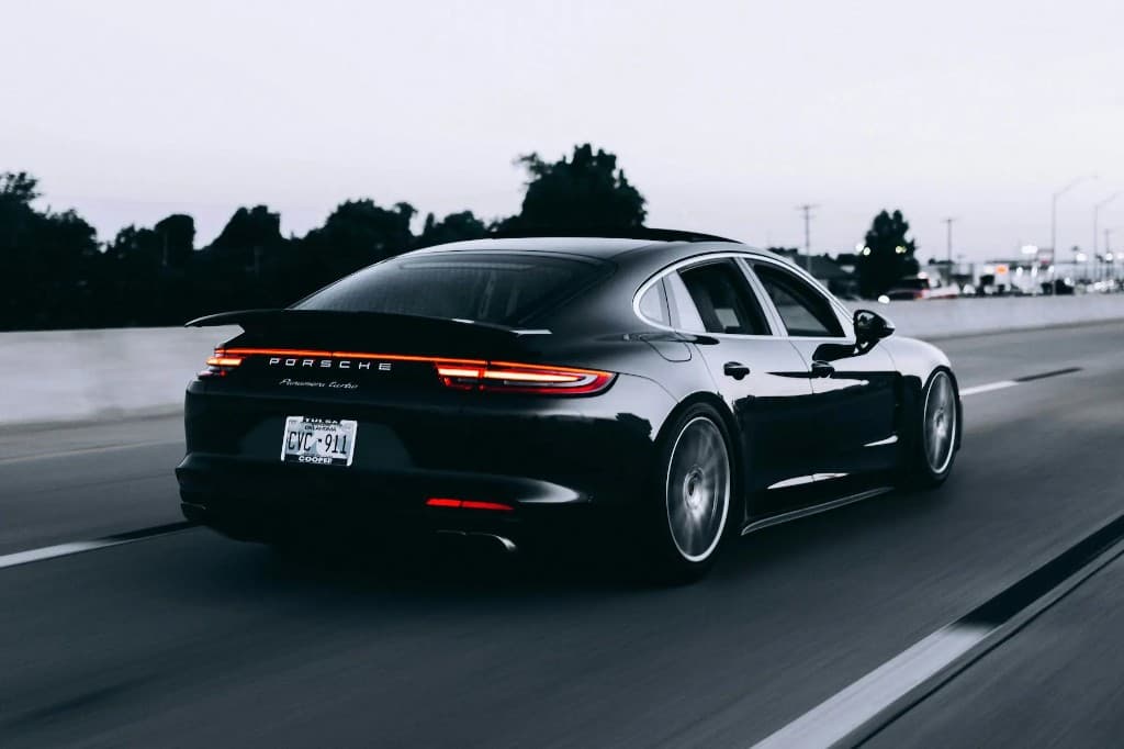Luxury sports sedan with a glossy detailed finish in motion